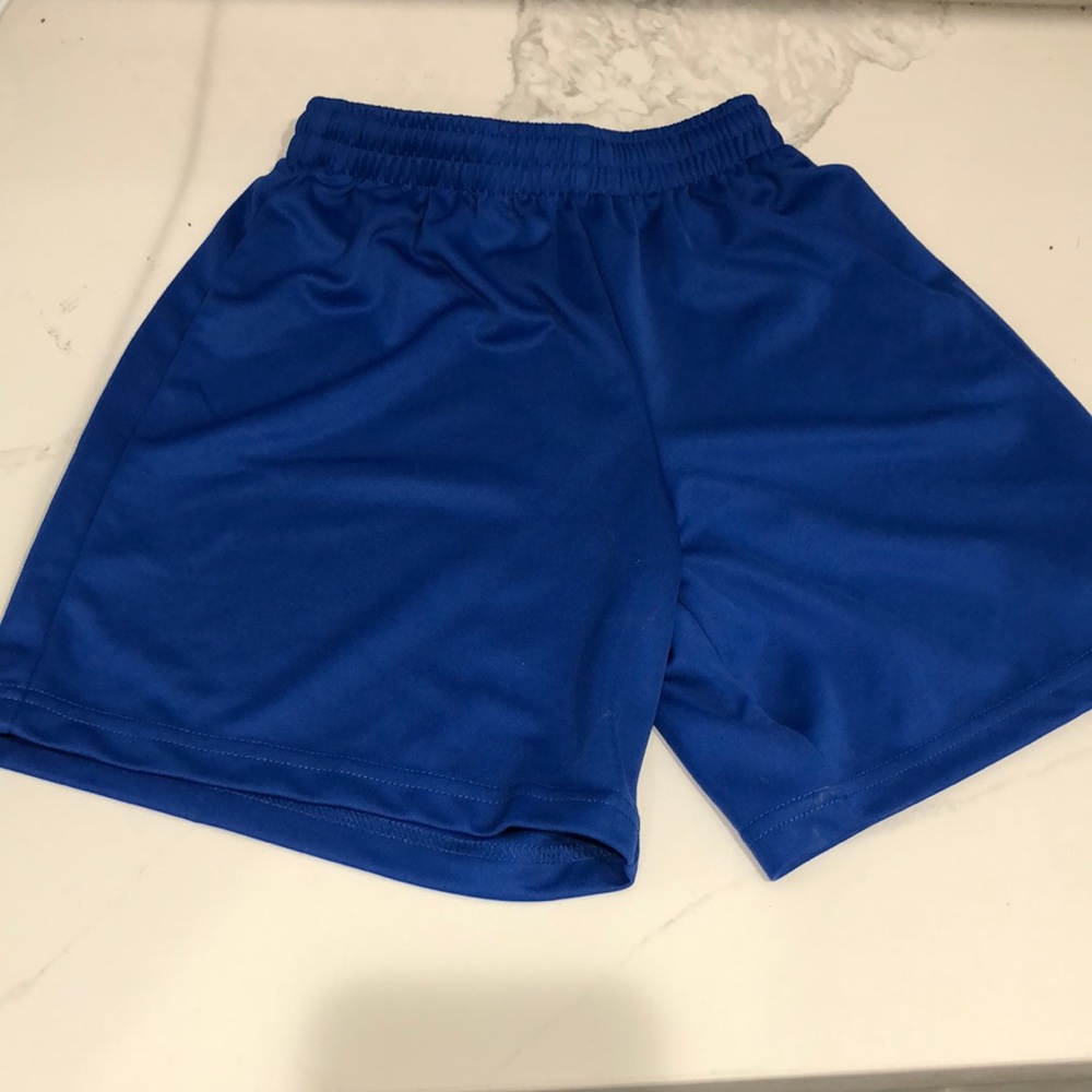 Blue soccer shorts for boys. Elastic waste size youth large